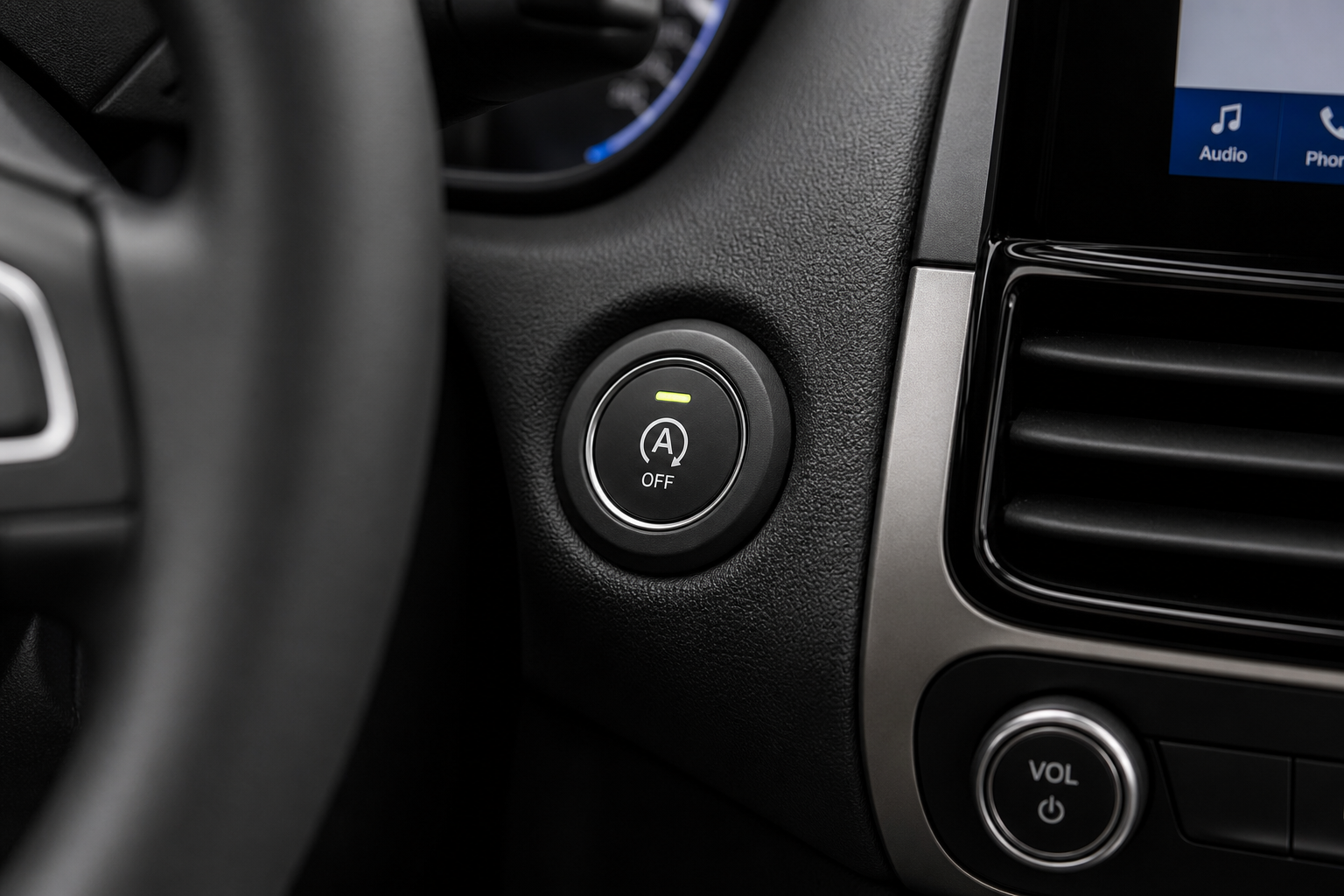 Auto start/stop button on a modern SUV dashboard center console