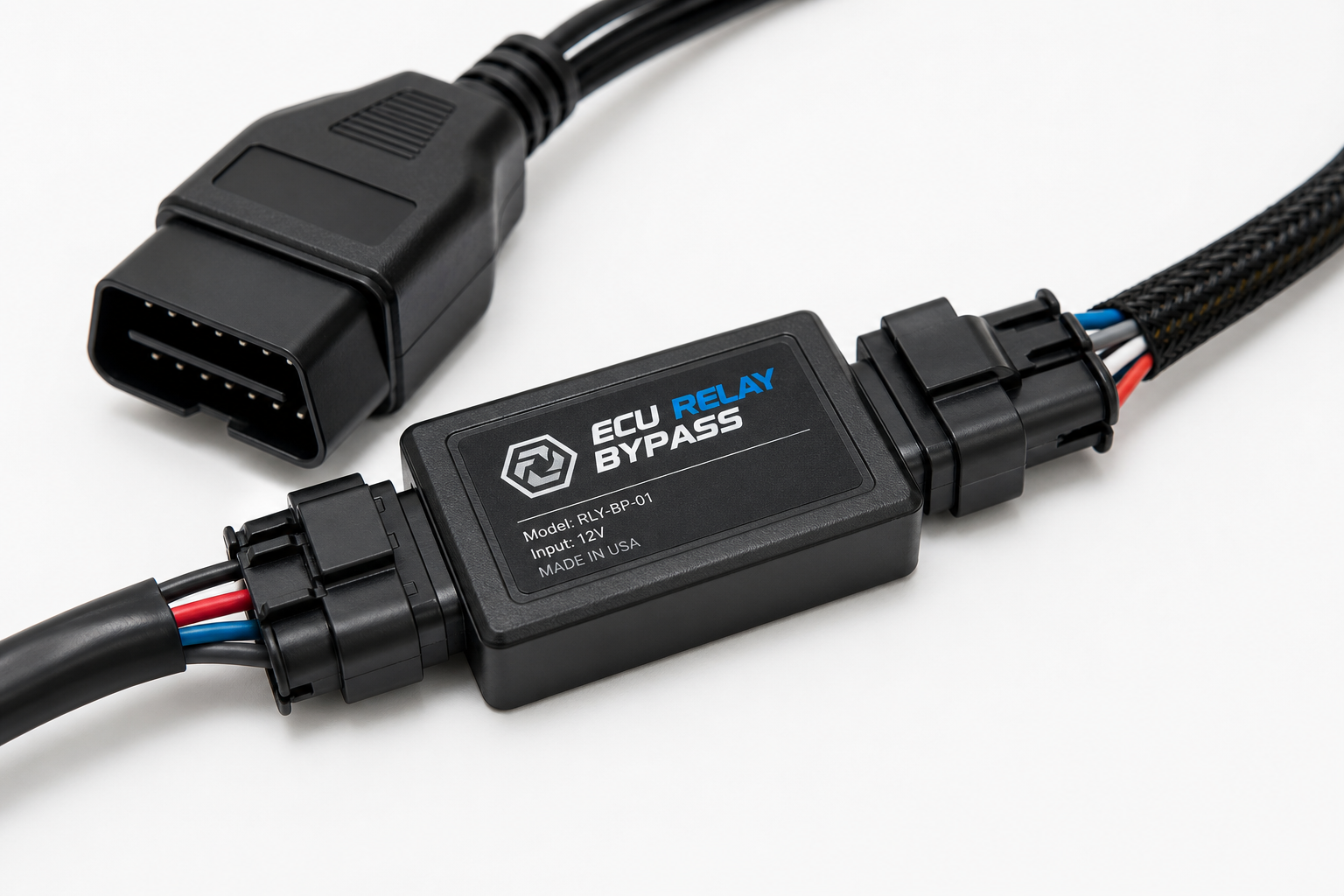 Small electronic i-Stop eliminator bypass module with vehicle connector harness on a white surface