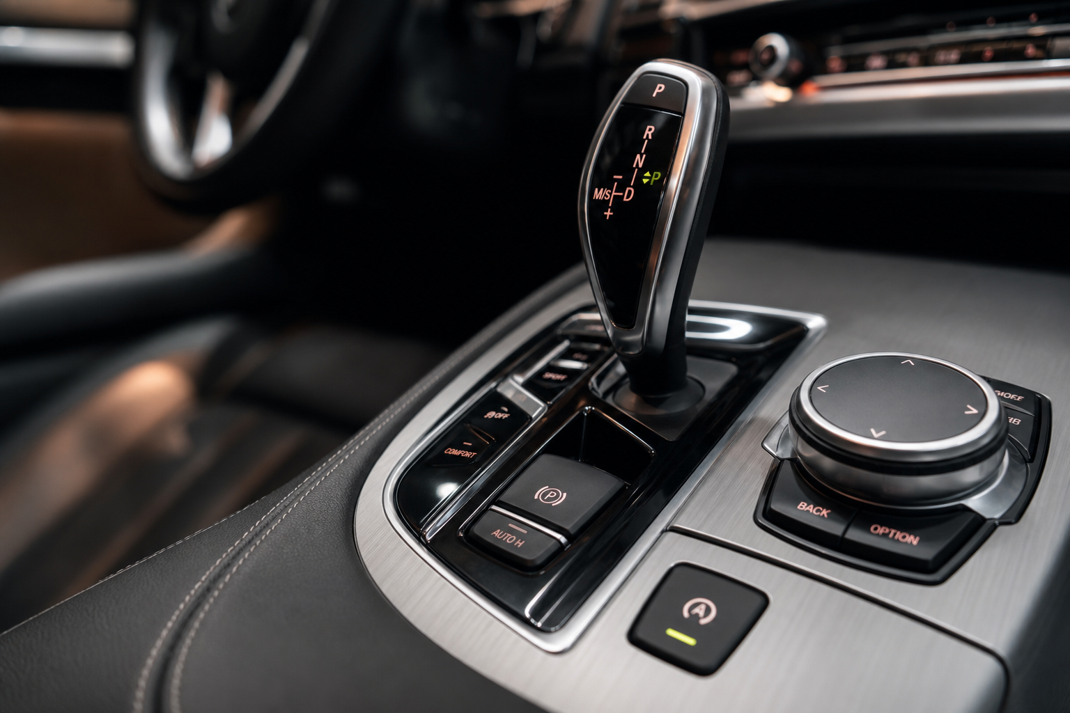 Close-up of the Auto Start Stop disable button on a car center console