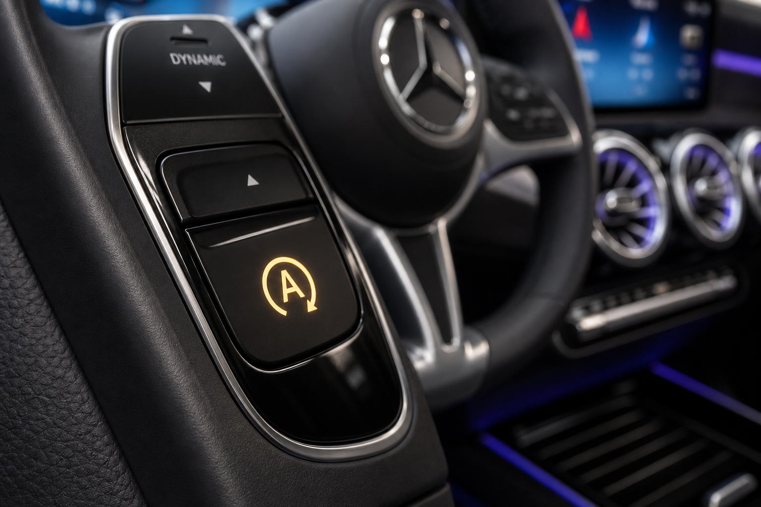 Close-up of the Auto Start/Stop button on a Mercedes-Benz GLB center console