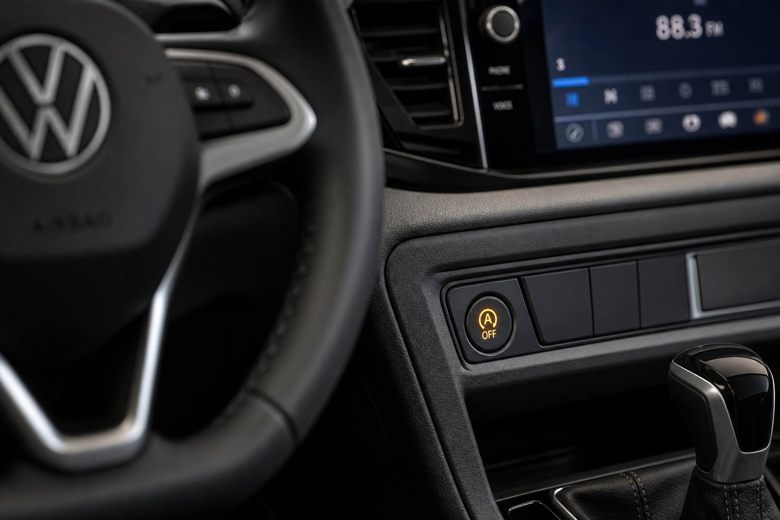 Close-up of the auto start/stop button on a Volkswagen Taos center console