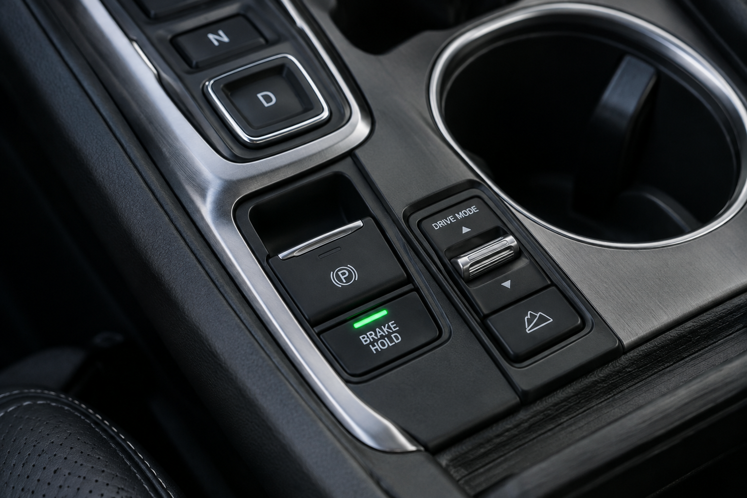 Close-up of the Brake Hold button on a Honda Pilot center console