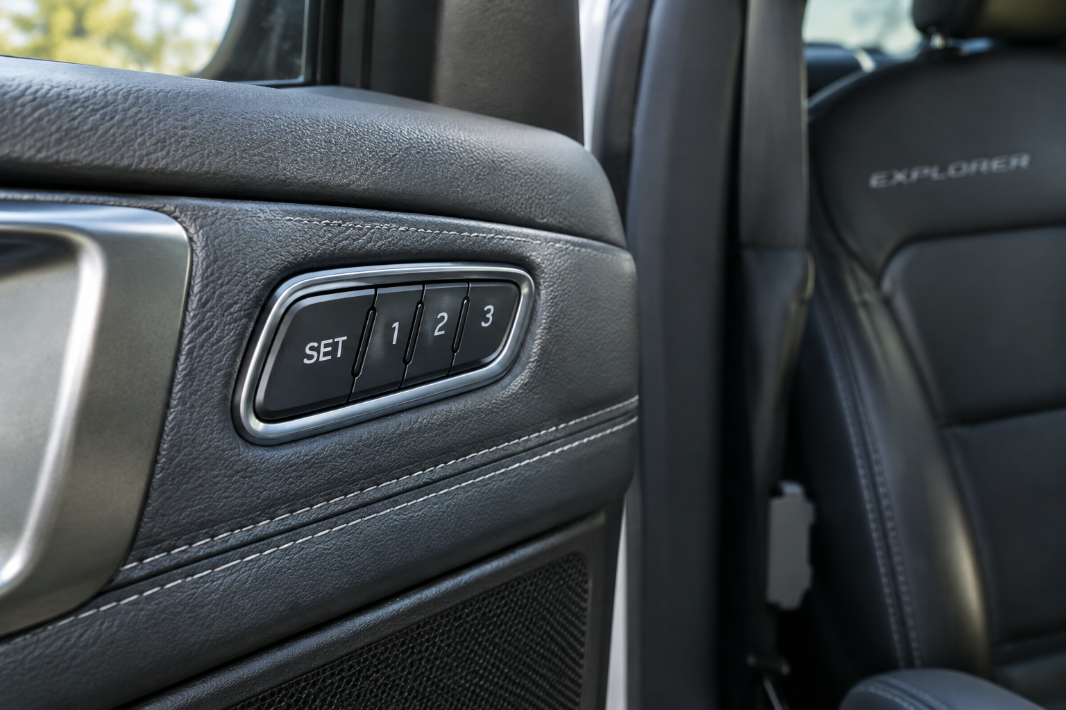 Close-up of Ford Explorer driver's door memory seat control buttons