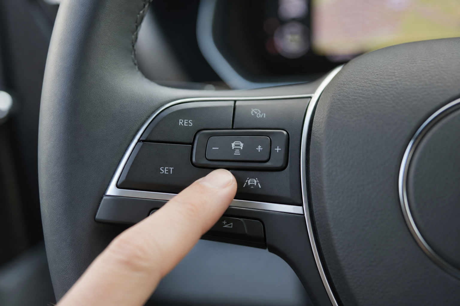 Close-up of a driver pressing the lane assist button on a car steering wheel