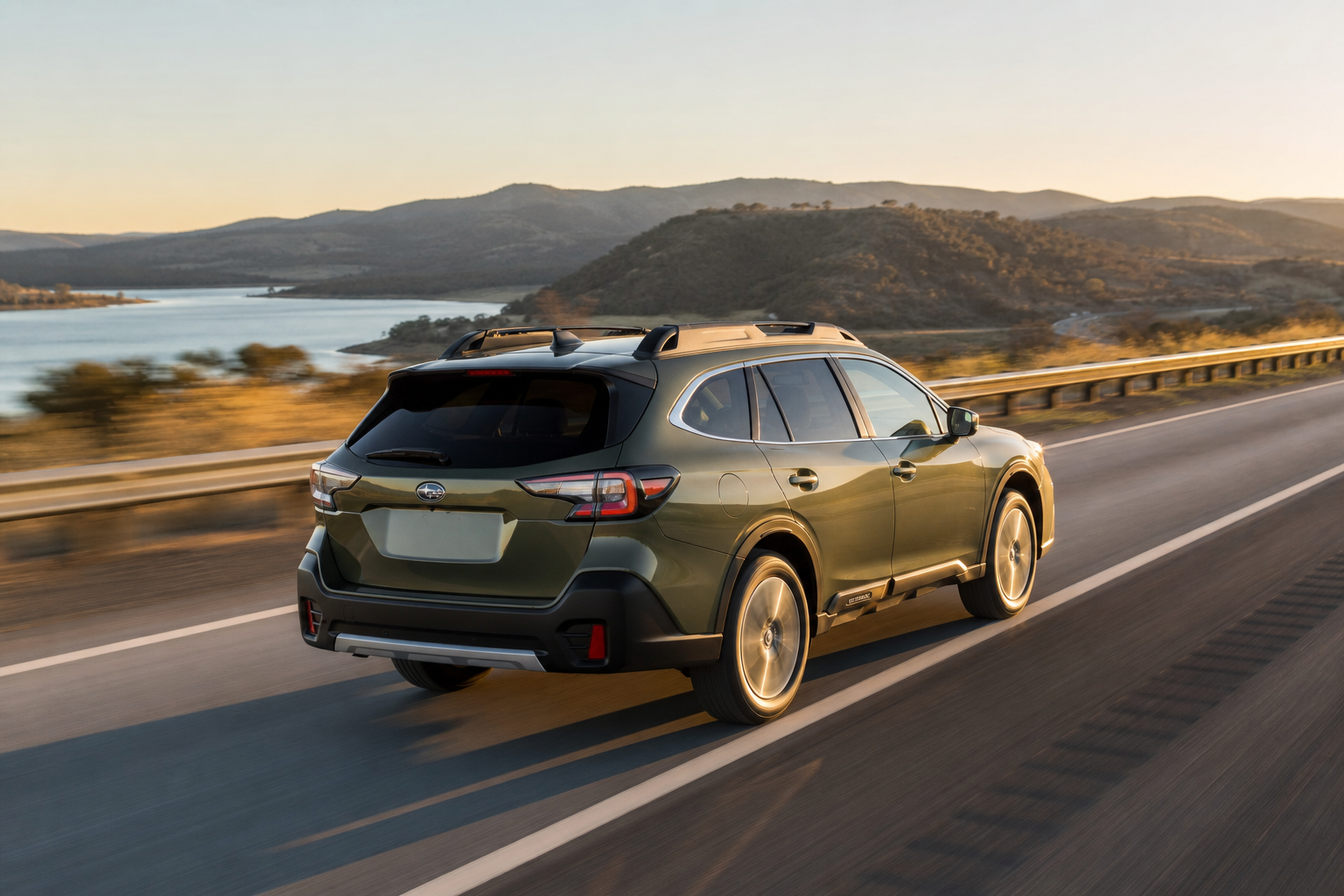 Subaru Outback cruising steadily on an open highway at golden hour