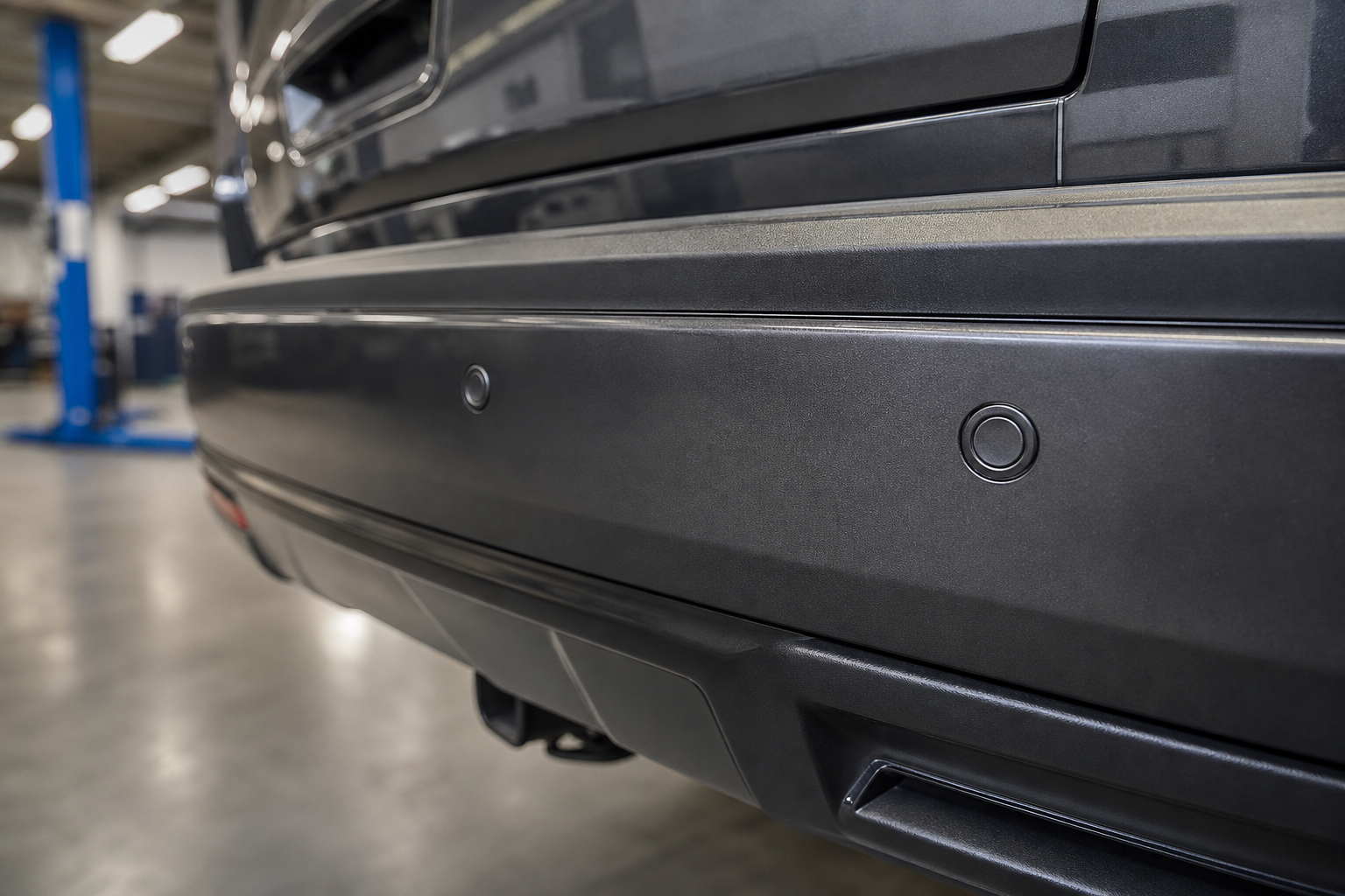 Close-up of rear parking sensors on a Chevy Tahoe bumper