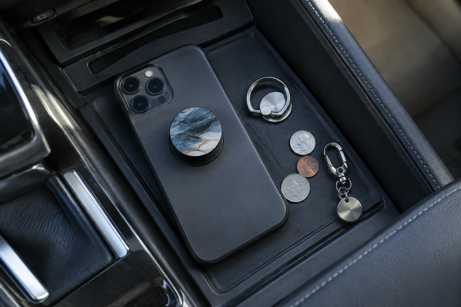 Metal objects and PopSocket near a car wireless charging pad