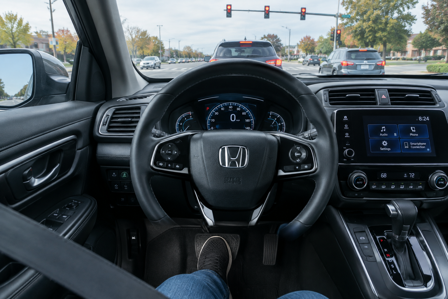 Driver's foot pressing the brake pedal while stopped, illustrating conditions needed for brake hold
