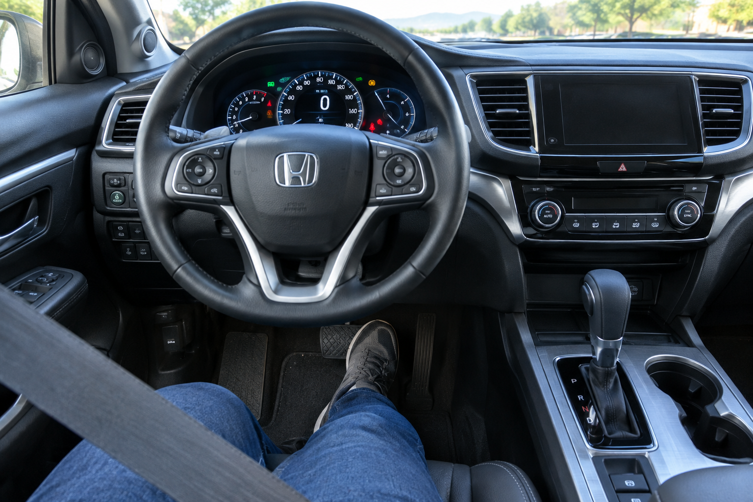 Driver pressing brake pedal in a Honda Pilot showing conditions for Brake Hold engagement