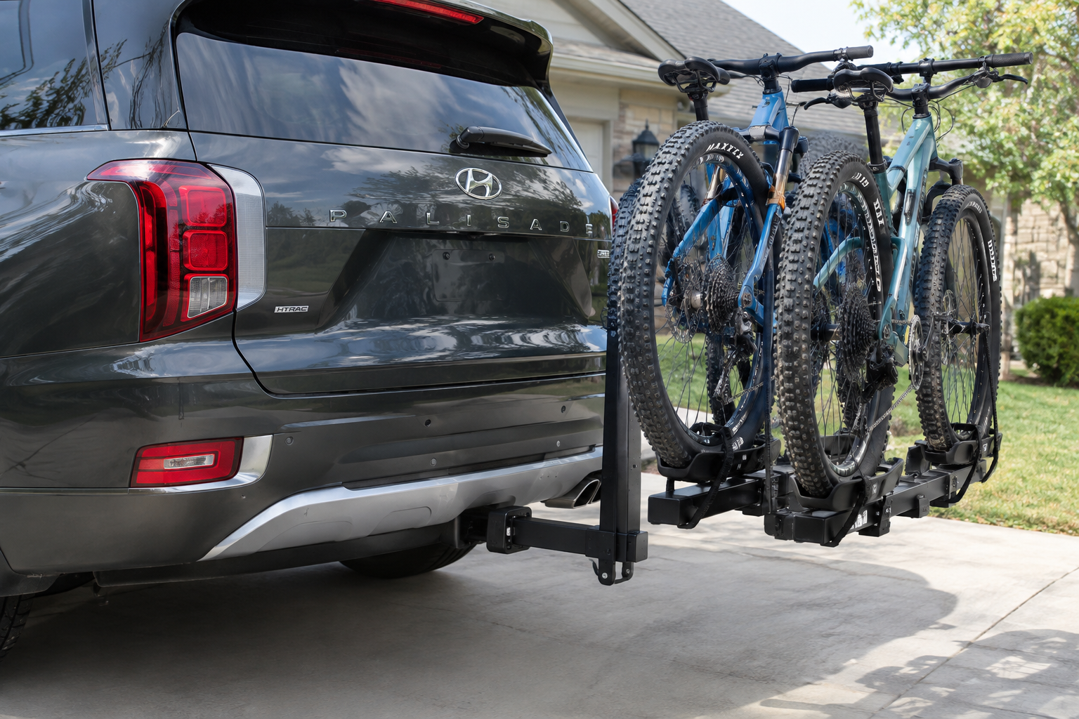 Hyundai Palisade rear bumper with tow hitch and bike rack installed near parking sensors