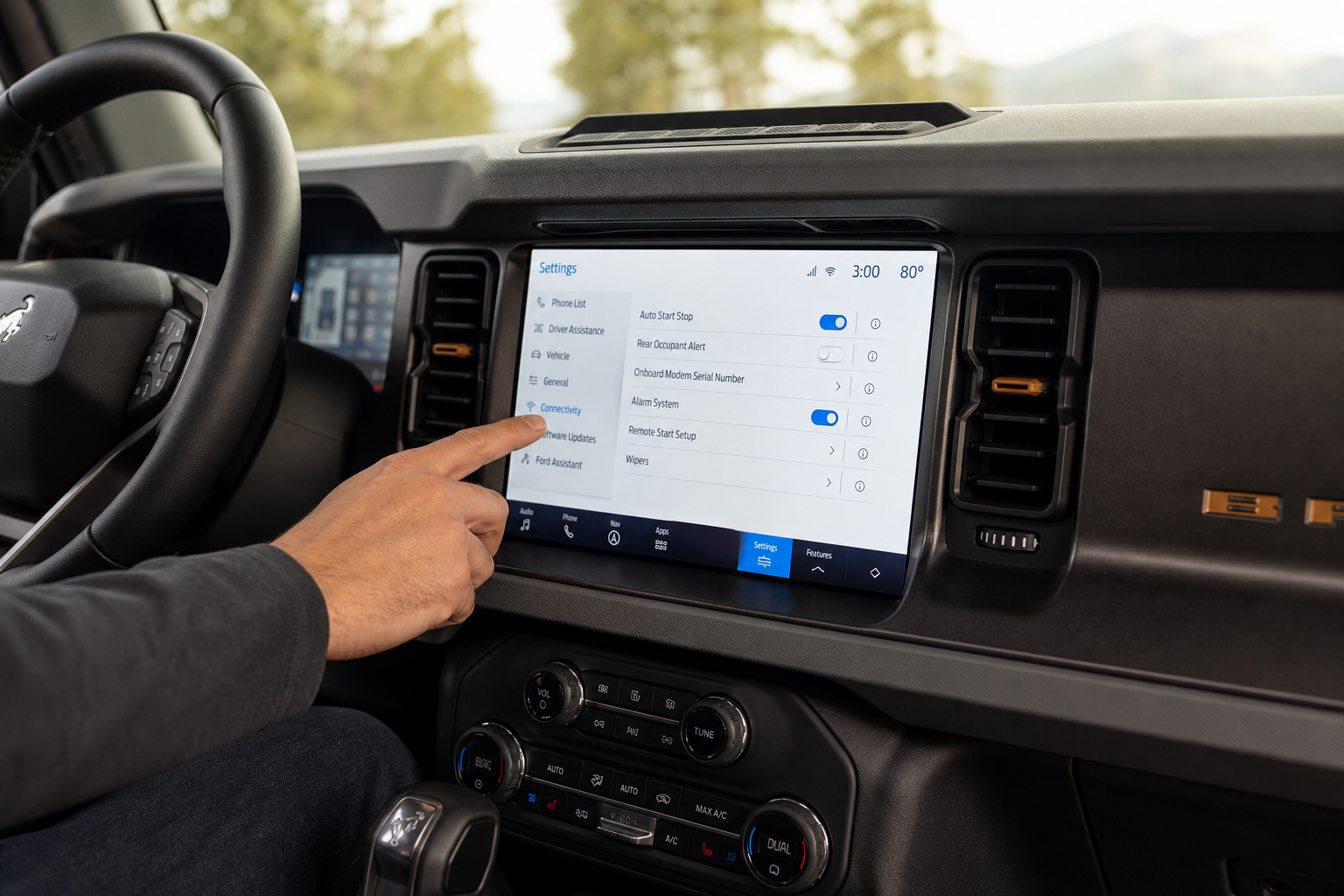 Hand adjusting settings on Ford Bronco SYNC touchscreen display