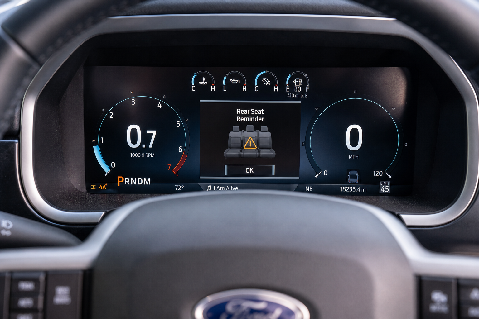 Ford F-150 instrument cluster displaying a rear seat reminder icon