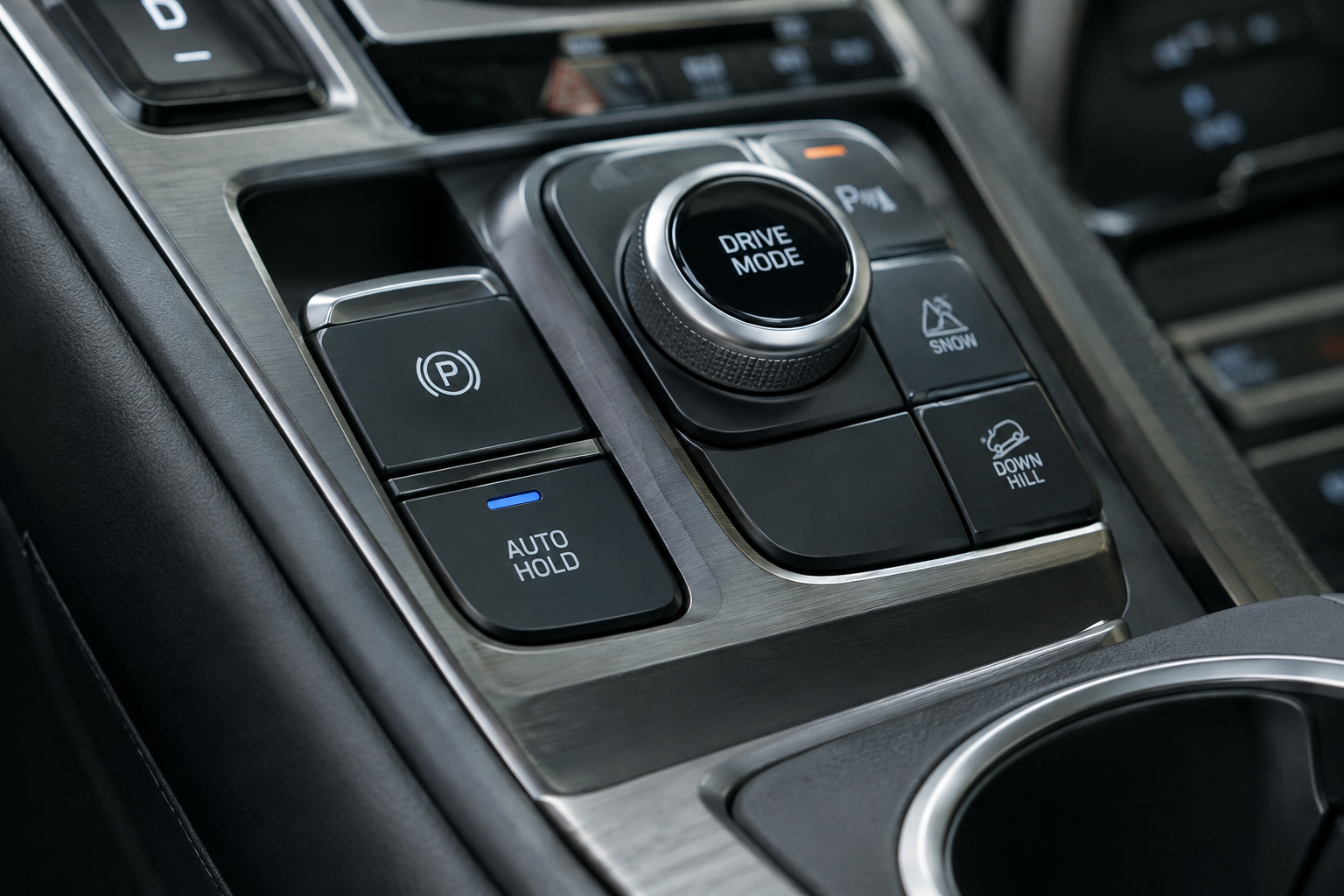 Close-up of the Auto Hold button illuminated on a Hyundai Santa Fe center console