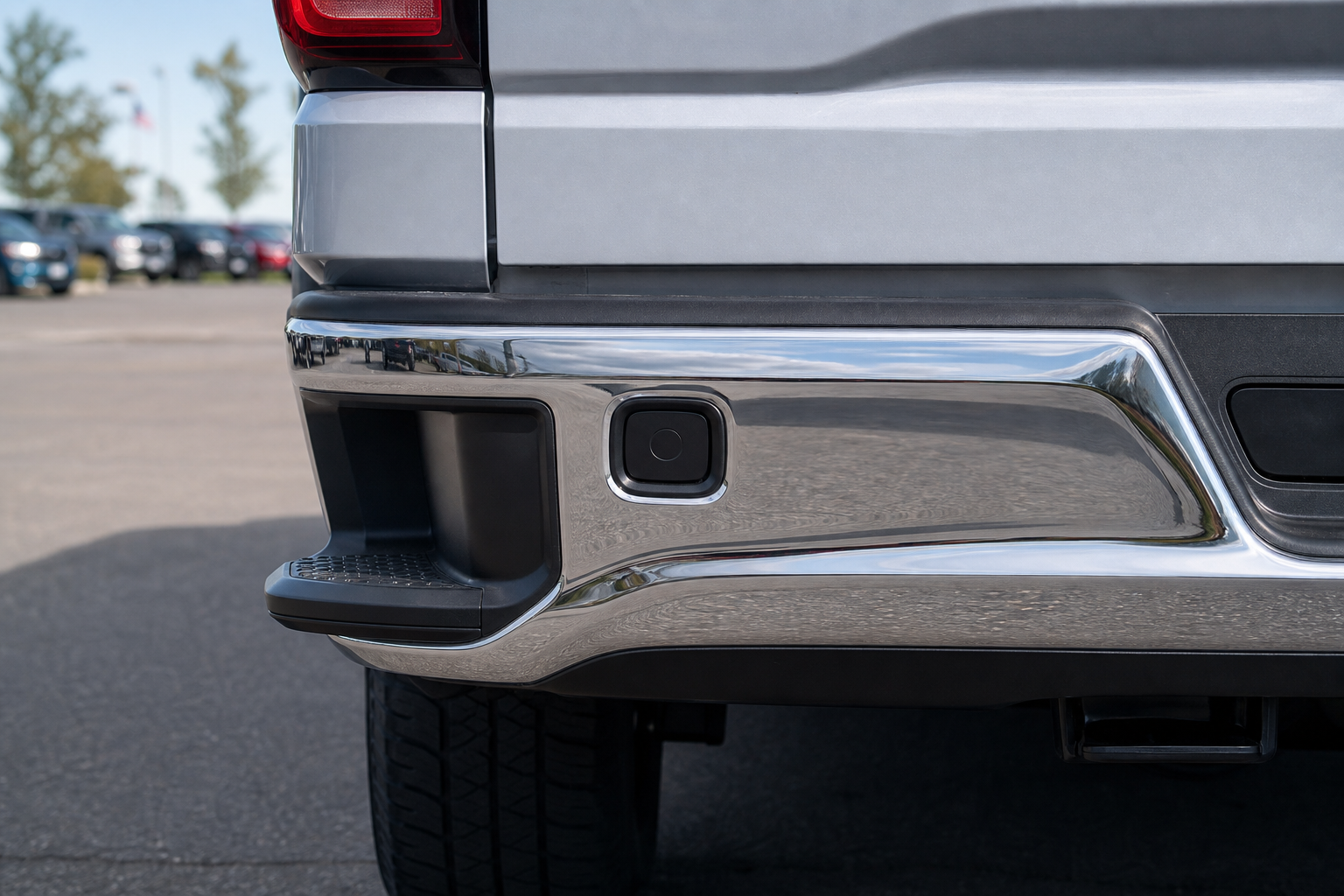Close-up of blind spot sensor location on GMC Sierra 1500 rear bumper