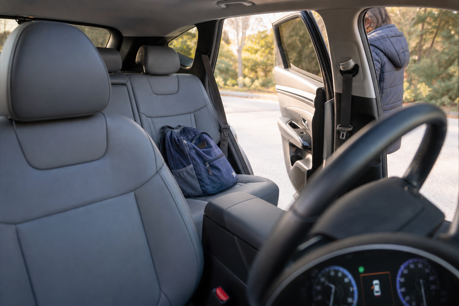 Interior of a Hyundai Tucson showing the rear seat area where the rear occupant alert sensor detects movement