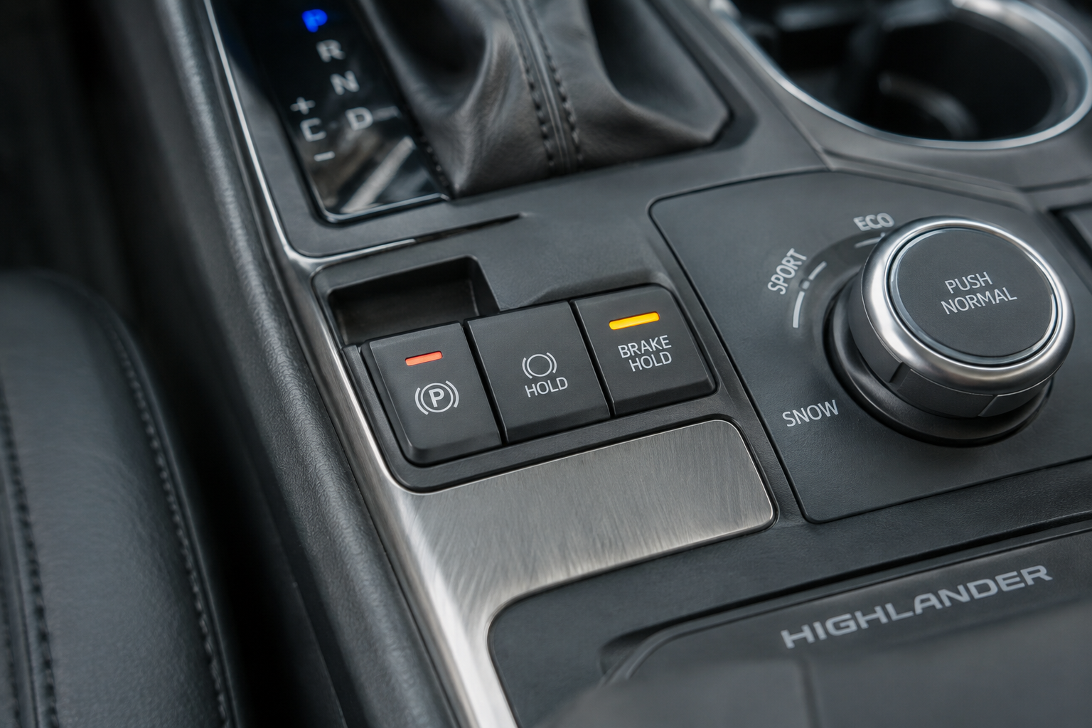 Close-up of Toyota Highlander Brake Hold button on center console
