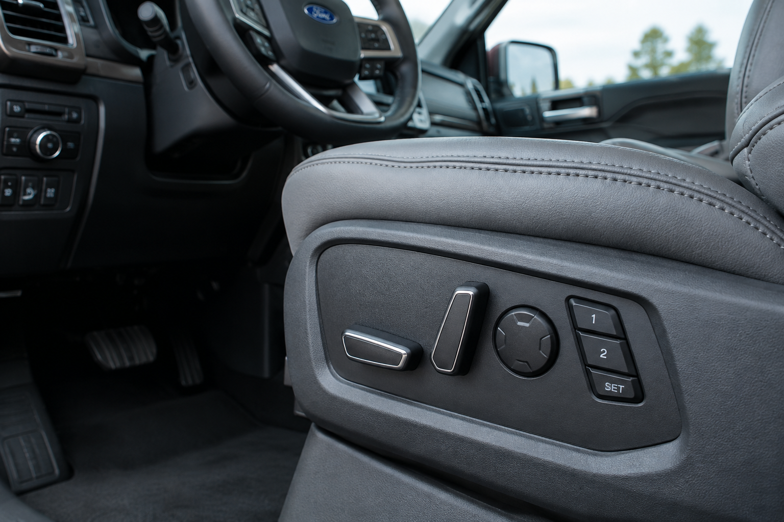 Close-up of Ford F-150 driver seat memory buttons on the side control panel
